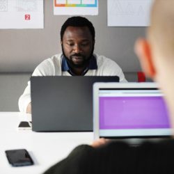 man with beard on laptop