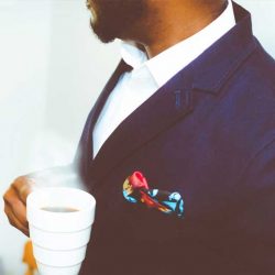 man in suit with coffee