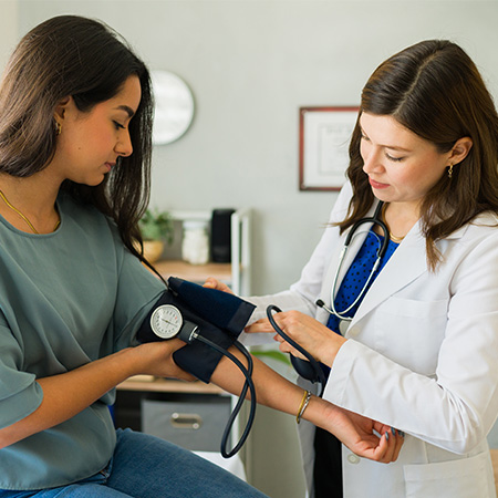 woman taking blood pressure